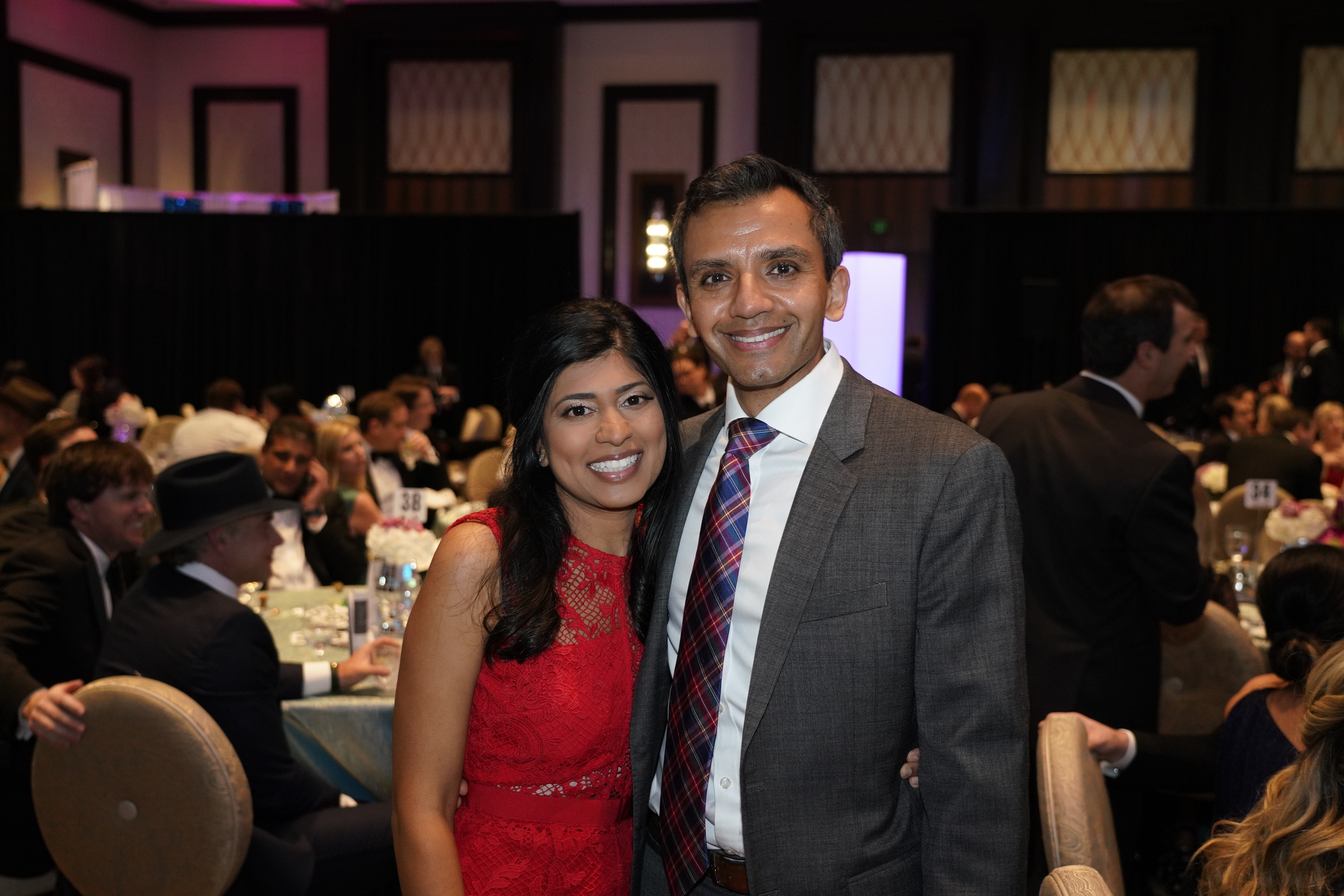 Two adult guests smiling together at a ROCO event